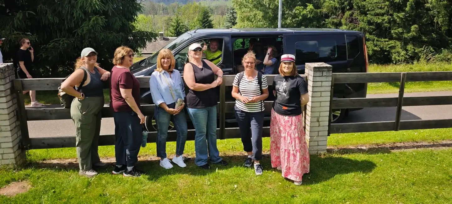 Small tourist group with a car